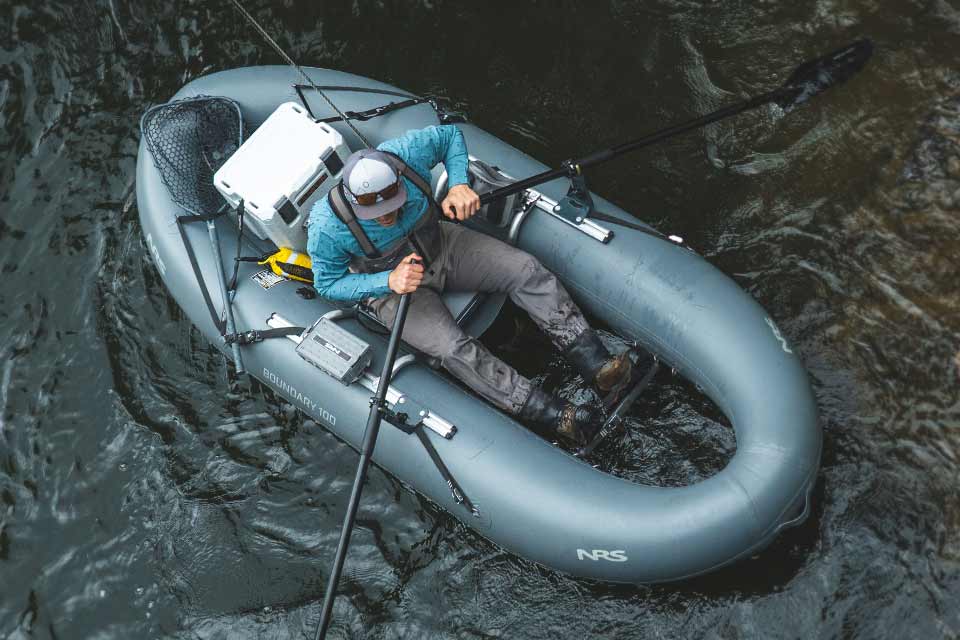 Aerial view of a man rowing an NRS Boundary 100 Fishing Raft.