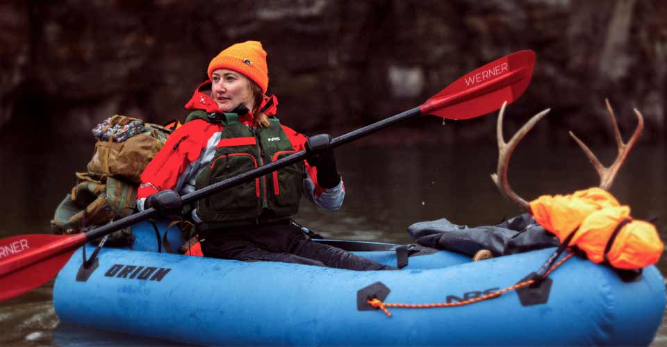 A hunter paddles a fully loaded NRS Orion Packraft.