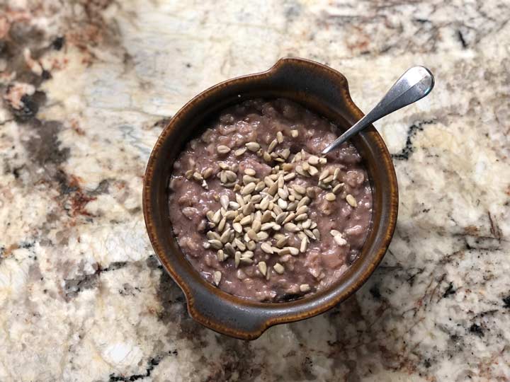 ceramic bowl of dark oatmeal