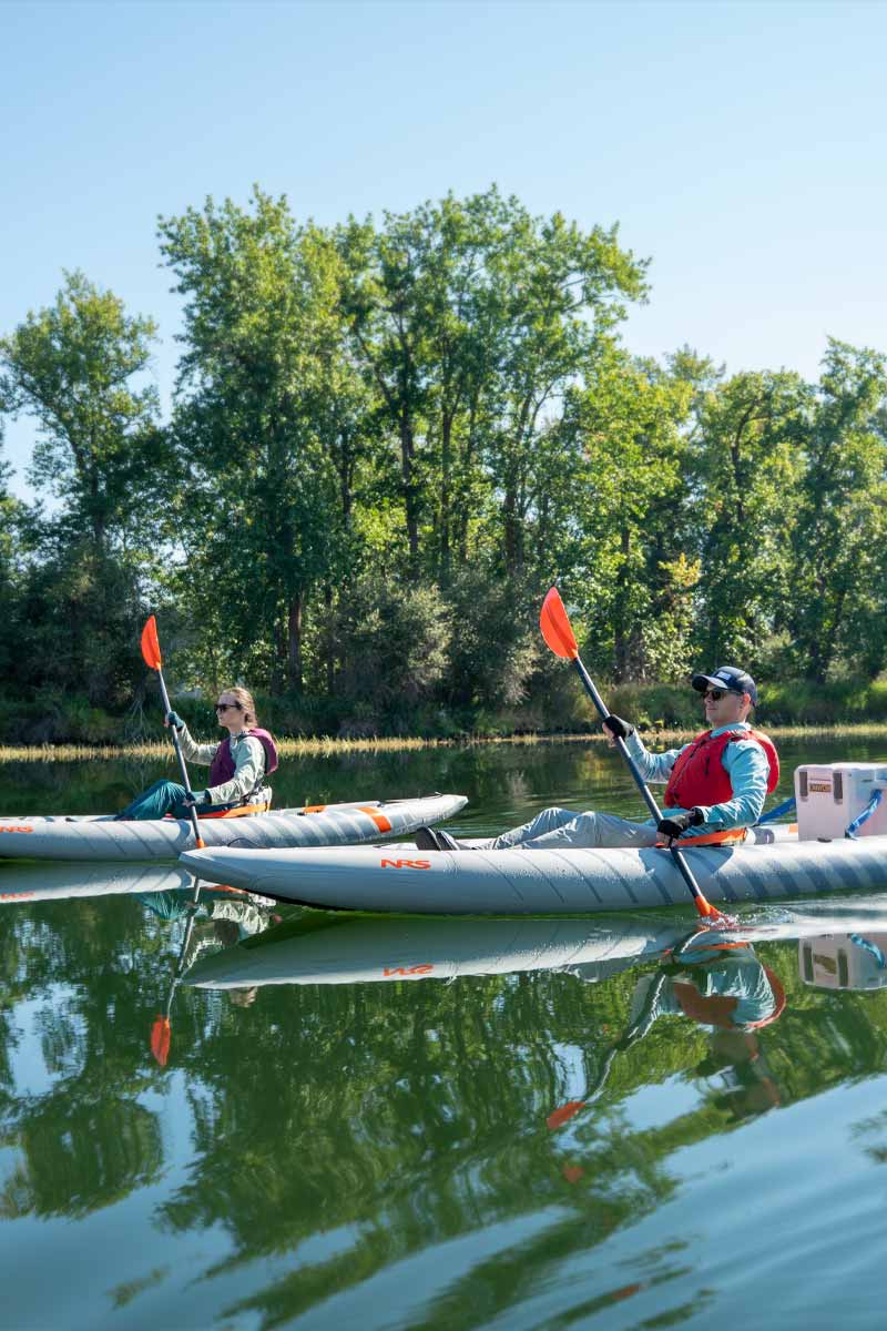 Sunglasses donned, a couple paddles through a casual river in the Akamai 110 and 125 kayaks.